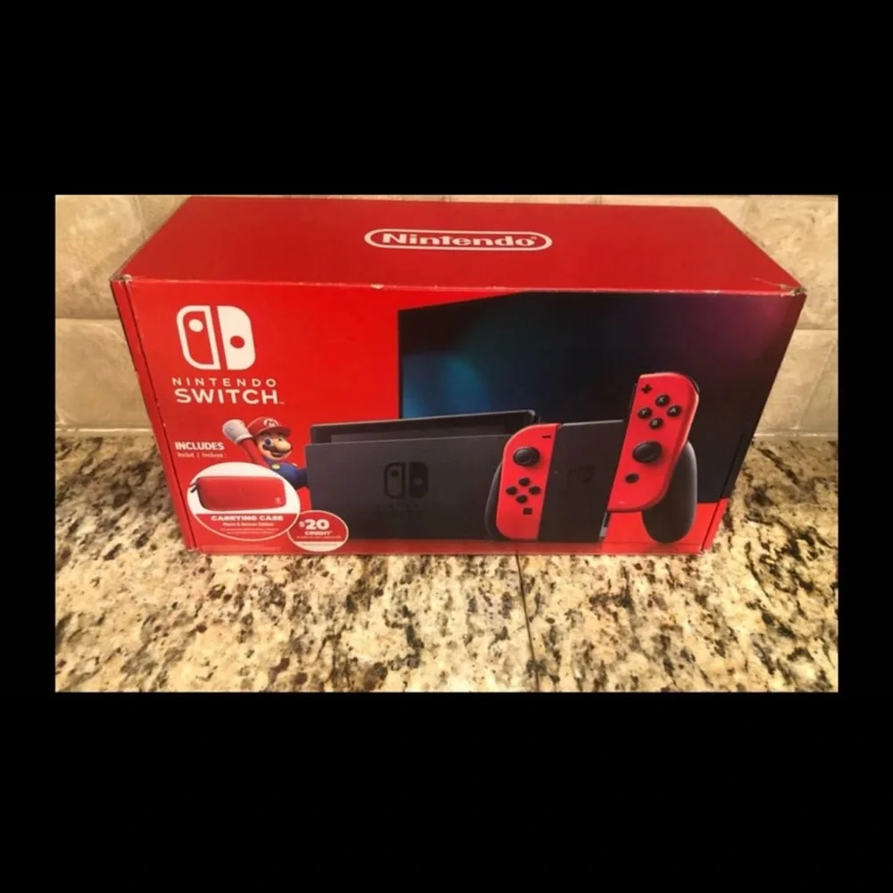 Nintendo Switch Console with Red and Black Controllers